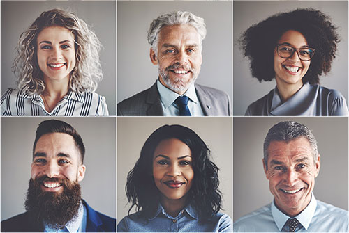 The photo shows a group of smiling business anthropologists in a modern corporate culture.